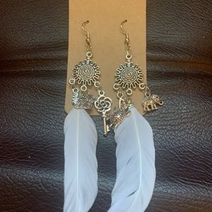 Handmade charm and feather earrings